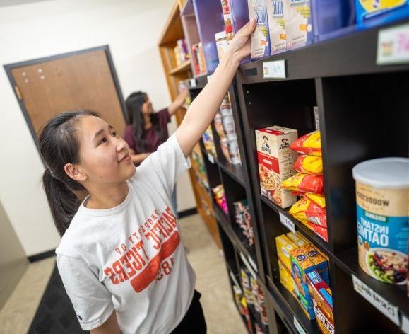 students picking out food from food pantry